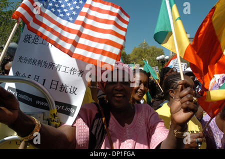 May 01, 2006; Manhattan, NY, USA; NY PAPERS OUT. Yaya Dam, of Harlem, originally from Namibia, waves a flag as tens of thousands of people turn out for the May 1 Great American Boycott and Immigration Rights Rally at Union Square Park. Mandatory Credit: Photo by Bryan Smith/ZUMA Press. (©) Copyright 2006 by Bryan Smith Stock Photo