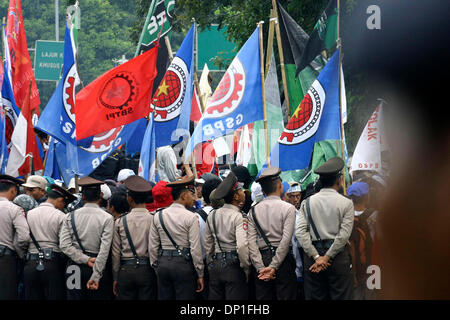 May 01, 2006; Jakarta, INDONESIA; Police guarded the Presidential Palace when workers welcomed the International Worker Day. Thousands of workers from various regions rallied for marking the International Workers Day Ð May Day. Beside protest of the revisions to labor law, they also demand government to declare May Day as a national holiday. Police at the demonstration kept close w Stock Photo