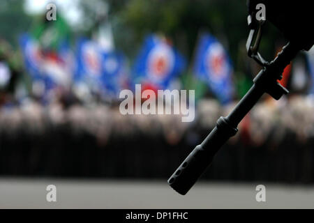 May 01, 2006; Jakarta, INDONESIA; Police guarded the Presidential Palace when workers welcomed the International Worker Day. Thousands of workers from various regions rallied for marking the International Workers Day Ð May Day. Beside protest of the revisions to labor law, they also demand government to declare May Day as a national holiday. Police at the demonstration kept close w Stock Photo