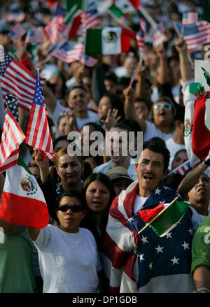 May 01, 2006; San Diego, CA, USA; (left to right, front row) MARTHA ORDUNA, ARACELI MORALES, and PORFIRIO ORDUNA cheer 'Si se puede' during the Day of Action in San Diego which ended with a rally anc candlelight vigil in Balboa Park.  It was estimated that about 10 thousand or more immigration supporters attended the rally and candlelight vigil.  Mandatory Credit: Photo by Nancee E Stock Photo
