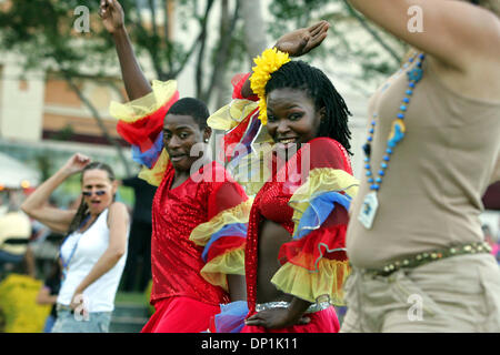 May 03, 2006; West Palm Beach, FL, USA; Florida's largest music, art and waterfront festival, Sunfest held its 'All-Access Party' Wednesday in downtown West Palm Beach. Kool & the Gang performed in the evening. Here, Latasha Strawder and Marcus Pough (center, in red) dance with Mona Seering (left, of Michigan) and Tara Rudakas (right, of Miami Beach) to the music of Island Heat.  M Stock Photo