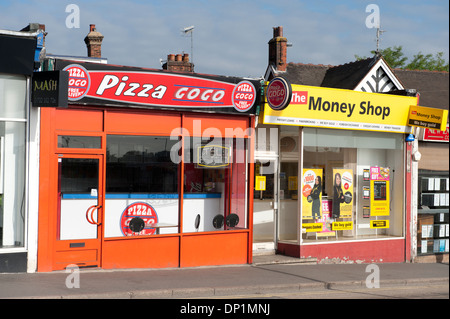 Money shop and pizza shop next to each other in Kent Stock Photo