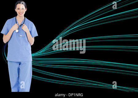 Composite image of smiling medical intern wearing a blue short-sleeve uniform Stock Photo