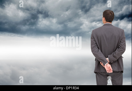 Composite image of rear view of classy businessman posing Stock Photo