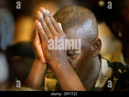 May 07, 2006; Delray Beach, FL, USA; A man prays during Mass as Charismatic Christians worship at  Delray Beach's Our Lady of Perpetual Hope on Sunday for their statewide convention.  Mandatory Credit: Photo by Lannis Waters/Palm Beach Post/ZUMA Press. (©) Copyright 2006 by Palm Beach Post Stock Photo