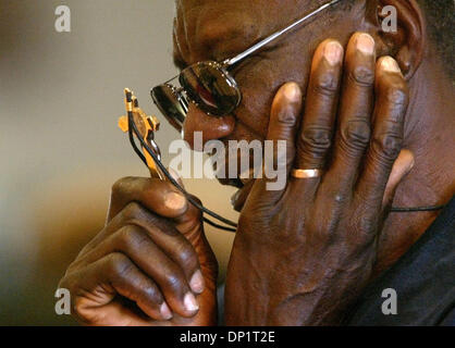 May 07, 2006; Delray Beach, FL, USA; A man holds his cross while he prays as Charismatic Christians worshiped at  Delray Beach's Our Lady of Perpetual Hope on Sunday. Mandatory Credit: Photo by Lannis Waters/Palm Beach Post/ZUMA Press. (©) Copyright 2006 by Palm Beach Post Stock Photo