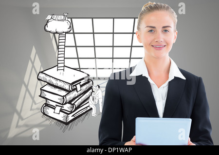 Composite image of businesswoman holding tablet Stock Photo