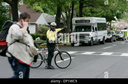 May 09, 2006; Fort Lee, NJ, USA; Making his way to New York, STEVE VAUGHT (The Fatman Walking) walks across the street with the assistance of Police Officer Douglas Cabler of the Fort Lee Police Department on Tuesday in Fort Lee, New Jersey. Mandatory Credit: Photo by Eduardo Contreras/SDU-T/ZUMA Press. (©) Copyright 2006 by SDU-T Stock Photo