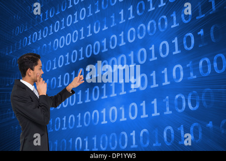 Composite image of thoughtful asian businessman pointing Stock Photo