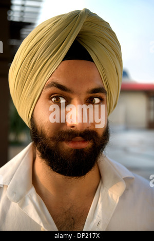 Young, turban, Sikh, man, funny expression, Indian, raised eyebrow Stock Photo