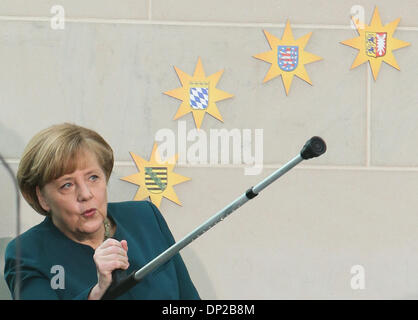 Berlin, Germany. 7th Jan, 2014. German Chancellor Angela Merkel uses ...