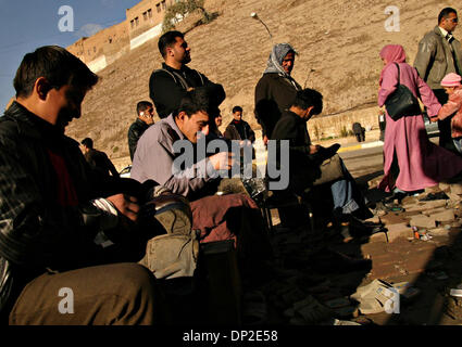 May 31, 2006; Arbil, Kurdistan, IRAQ; 22-year-old Hiwa, a shoe-shiner (2nd from the left), works with his friends on the street, underneath the citadel in the very centre of Arbil, Iraqi Kurdistan, Jan 16. 2006, claiming that shoe polishing job is great and that he sometimes earns up to 20.000 Iraqi dinars a day (about 15 USD). Mandatory Credit: Photo by Sasa Kralj/JiwaFoto/ZUMA Pr Stock Photo