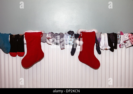 collection of socks drying on a radiator Stock Photo