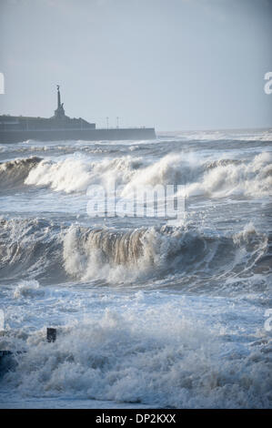 Aberystwyth, UK. 7th January 2014. Repair work goes ahead as the Victorian seaside town of Aberystwyth enters the fith day of being battered by huge waves and storm force winds resulting from a Storm Surge associated with a low pressure system located to the north west of Scotland. Credit:  Graham M. Lawrence/Alamy Live News. Stock Photo