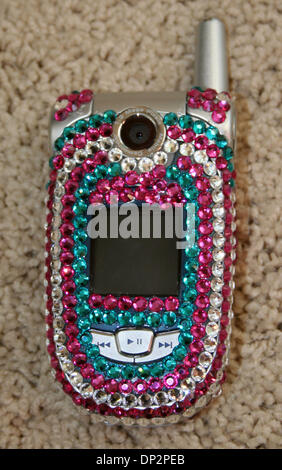 Jun 10, 2006; Laguna Beach, CA, USA;  A cell phone gets decorated with Swarovski crystals - a term known as Blinging.  Many young celebrities have their phones, Sidekicks and Blackberries blinged. Mandatory Credit: Photo by Camilla Zenz/ZUMA Press. (©) Copyright 2006 by Camilla Zenz Stock Photo
