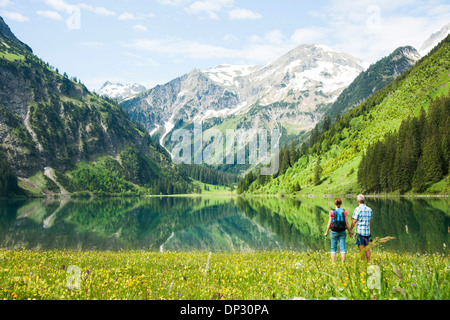 Couple Hiking by Lake, Vilsalpsee, Tannheim Valley, Tyrol, Austria Stock Photo