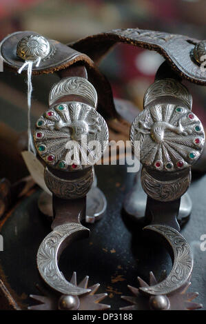 Jun 15, 2006; Fredericksberg, TX, USA; California style pair of single mounted peacock pattern spurs with markings of E. Garcia. Silver flower buttons along with crecent shaped shanks with leather will be auctioned in lot 26.  Mandatory Credit: Photo by Delcia Lopez/San Antonio Express-News/ZUMA Press. (©) Copyright 2006 by San Antonio Express-News Stock Photo