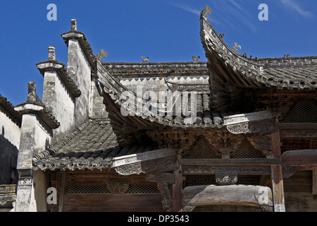 Peaked tile roof and carved wood facade of ancestral hall in Nanping, Anhui, China Stock Photo