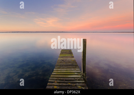 Wooden jetty on sea, Hayling Island, Hampshire, England, UK. Stock Photo