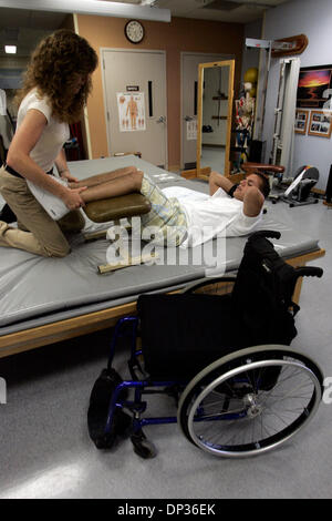 Jun 22, 2006; San Diego, CA, USA; Soldier DAVID MARTINS, who was paralyzed below the waist after being shot in crossfire outside of a bar in Georgia where he was celebrating with friends after returning from a tour of duty in Iraq.   VA hospitla physical therapist HAYLEY HOWELLS worked with MARTINS  in the physical therapy department at the Spinal Cord Injury Center at the VA on Th Stock Photo