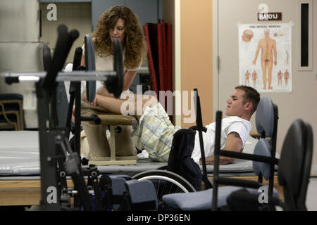 Jun 22, 2006; San Diego, CA, USA; Soldier DAVID MARTINS, who was paralyzed below the waist after being shot in crossfire outside of a bar in Georgia where he was celebrating with friends after returning from a tour of duty in Iraq.   VA hospitla physical therapist HAYLEY HOWELLS worked with MARTINS  in the physical therapy department at the Spinal Cord Injury Center at the VA on Th Stock Photo