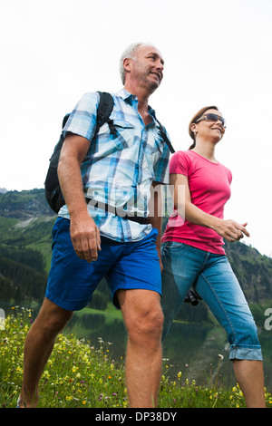 Close-up of mature couple hiking in mountains, Lake Vilsalpsee, Tannheim Valley, Austria