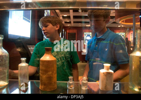 Jun 26, 2006; New Orleans, LA, USA; Two boys look at shipwreck artifacts in the Treasures of the Deep exhibit. Odyssey's Shipwreck and Treasure Adventure in New Orleans, LA lets you try your hand at using the latest technology to retrieve underwater treasures and showcases some of the discoveries from the SS Republic, a Civil War era sidewheel steamer that went down in a hurricane  Stock Photo