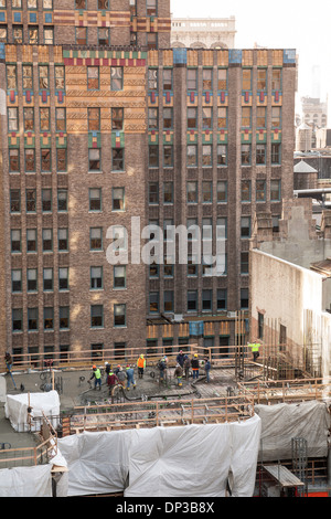 Construction of the building. Workers unrecognizable make metal ...