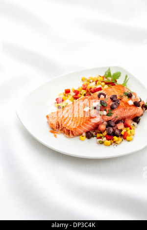 Single Serving of Salmon Fillet with Black Beans, Corn, Onions, Red Peppers and Cilantro, Studio Shot Stock Photo