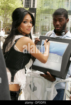 Jun 30, 2006; New York, NY, USA; Lead singer NICOLE SCHERZINGER from the burlesque pop group the 'Pussycat Dolls' autographs a fan's new APPLE computer box after her performance for the CBS morning program 'The Early Show' held at Apple Plaza. Mandatory Credit: Photo by Nancy Kaszerman/ZUMA Press. (©) Copyright 2006 by Nancy Kaszerman Stock Photo