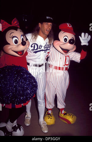 Jul 06, 2006; Los Angeles, CA, USA; [File Photo: Date Unknown] Singer  MICHAEL BOLTON dressed in Dodger Uniform poses with MICKEY MOUSE and MINNY  MOUSE at the Dodger Celebrity Baseball Game held