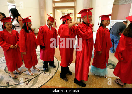 Jul 15, 2006; San Diego, CA, USA; Fifth graders stand in line as they prepare for their graduation from the Barrio Logan College Institute at the University of San Diego in the Joan Kroc Institute for Peace and Justice on Saturday afternoon. From left; KATTHY RUIZ, 11, left, LESLIE ROSAS, 10, MIGUEL MARTINEZ, 11, ROSALVA GODOY, 11, center, JORGE LUIS DUARTE, 11, and MELYNA AVALOS,  Stock Photo