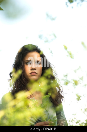 Portrait of teenaged girl outdoors in nature, looking downward, Germany Stock Photo