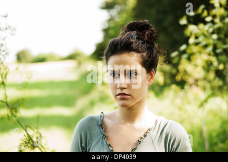 Portrait of teenaged girl outdoors in nature, looking into the distance, Germany Stock Photo