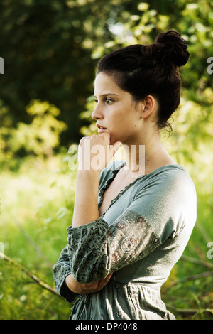 Portrait of teenaged girl outdoors in nature, looking at camera, Germany Stock Photo