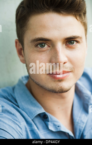 Close-up portrait of young man looking at camera, Germany Stock Photo