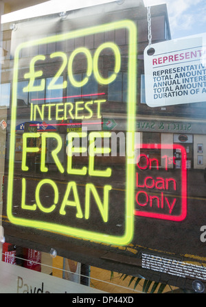 Neon sign in a high street shop window advertising a £200 interest free loan from a payday loans company Stock Photo