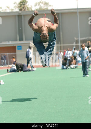 Jul 29, 2006; San Pablo, CA, USA; JESUS EL-LAZARD, 19, does a back flip during the BSAA (Black Sports Agents Association) sports and dance clinic at Contra Costa College. The clinic, thrown by Andre Farr, a former Kennedy High School and UCLA football player, featured motivational speakers and professional coaches giving instruction in basketball, football and dance among others. T Stock Photo