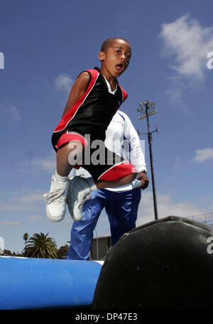 Jul 29, 2006; San Pablo, CA, USA; JERICK MOODY, 5, jumps over obstacles during football instruction at the BSAA (Black Sports Agents Association) sports and dance clinic at Contra Costa College. The clinic, thrown by Andre Farr, a former Kennedy High School and UCLA football player, featured motivational speakers and professional coaches giving instruction in basketball, football a Stock Photo