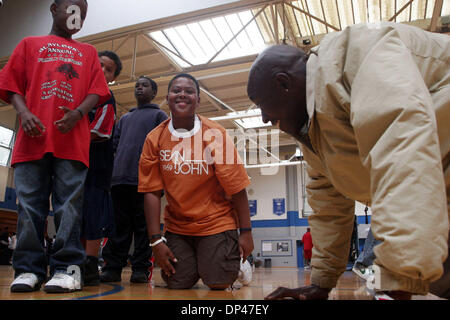 Jul 29, 2006; San Pablo, CA, USA; CENDAN CLAIBORNE, 10, laughs after doing push ups at the BSAA (Black Sports Agents Association) sports and dance clinic at Contra Costa College. The clinic, thrown by Andre Farr, a former Kennedy High School and UCLA football player, featured motivational speakers and professional coaches giving instruction in basketball, football and dance among o Stock Photo