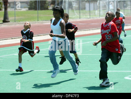 Jul 29, 2006; San Pablo, CA, USA; Participants run sprints during football instruction at the BSAA (Black Sports Agents Association) sports and dance clinic at Contra Costa College. The clinic, thrown by Andre Farr, a former Kennedy High School and UCLA football player, featured motivational speakers and professional coaches giving instruction in basketball, football and dance amon Stock Photo