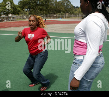 Jul 29, 2006; San Pablo, CA, USA; GERRINE WASHINGTON (left), 16, dances while RAYSHELL DAVIS, also 16, looks on at the BSAA (Black Sports Agents Association) sports and dance clinic at Contra Costa College. The clinic, thrown by Andre Farr, a former Kennedy High School and UCLA football player, featured motivational speakers and professional coaches giving instruction in basketball Stock Photo