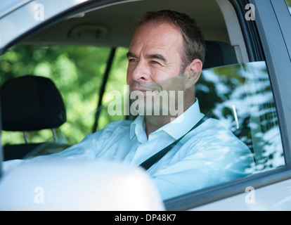 Businessman Driving Car, Mannheim, Baden-Wurttemberg, Germany Stock Photo