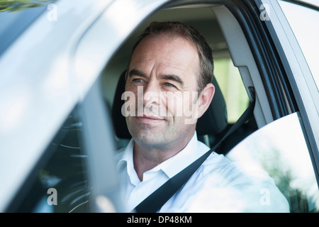 Businessman Driving Car, Mannheim, Baden-Wurttemberg, Germany Stock Photo