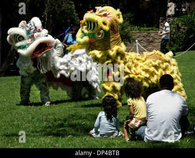 Aug 05, 2006; San Diego, CA, USA; The Van Kiep Line Dancers demonstate a Chinese tradition of dancing mythical lions at the Southeastern Development Corporation (SEDC) community festival at the Educational Cultural Complex Park. The dancers are put on the display to raise money for their Boy Scout Troop #1000 in San Diego. SEDC is a city-owned, nonprofit corporation involved in red Stock Photo