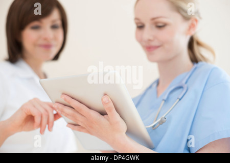 Doctors using a tablet computer Stock Photo