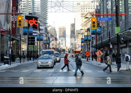 Toronto, Canada. 7th Jan 2014.  Only a few pedestrians are seen on normally one of the busiest intersections in Toronto at Yonge and Dundas due to the near minus 20 degrees Celsius weather. (Dominic Chan/EXImages) Credit:  EXImages/Alamy Live News Stock Photo