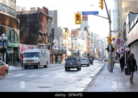 Toronto, Canada. 7th Jan 2014.  The extreme cold weather with near minus 20 degrees Celsius temperature has turned a normally busy section of Toronto's Yonge Street into a ghost town. (Dominic Chan/EXImages) Credit:  EXImages/Alamy Live News Stock Photo