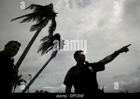 Aug 30, 2006; Boynton Beach, FL, USA; Boynton Beach Police Sergeant Steve Wessendorf (cq), right, points out to Sgt. Stewart Steele (cq) what he thinks is a loose boat on the Intracoastal Waterway Wednesday morning, Aug. 30, 2006. The Department expected much more activity, the worst of which would come from Tropical Storm Ernesto. The boat turned out to be on an anchor.  Mandatory Stock Photo