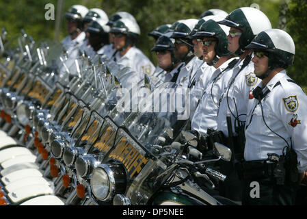 Sep 20, 2006; West Palm Beach, FL, USA; Sheriff's deputies who escorted the funeral procession for Edward Reynolds Wednesday observe the closing moments of the funeral outside St. Matthews Catholic church.  Scores of Palm Beach County Sheriff's deputies attended a funeral today for Edward 'Ned' Reynolds, 68, at St. Matthews Catholic Church. The funeral included a Palm Beach County  Stock Photo